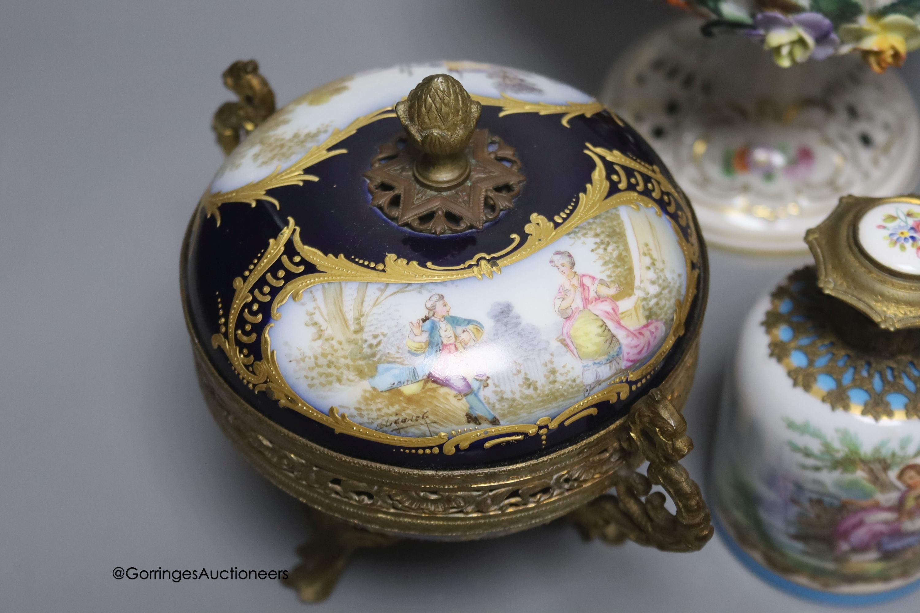 A Sevres style ormolu-mounted bowl and cover, a similar lidded vase and a scent bottle, tallest 22cm